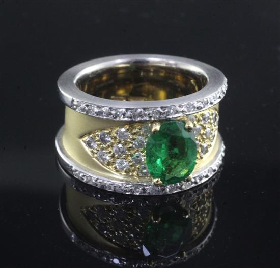 A modern 18ct two colour gold, green garnet and diamond set dress ring, size L.